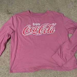 A coca-Cola shirt the size is adult small never been worn